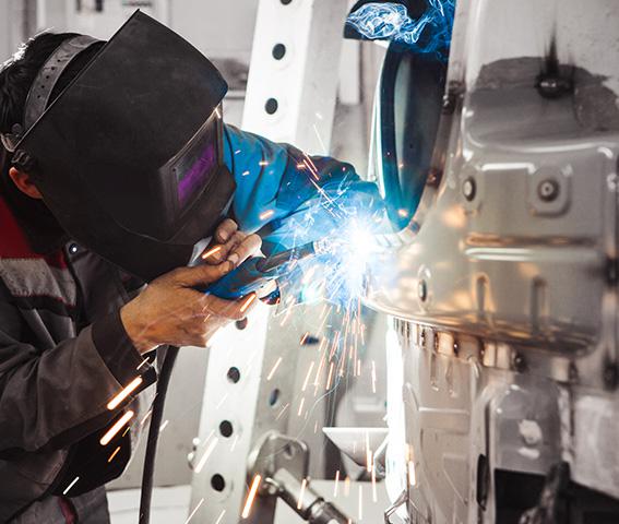 Technician Welding on a Car Body