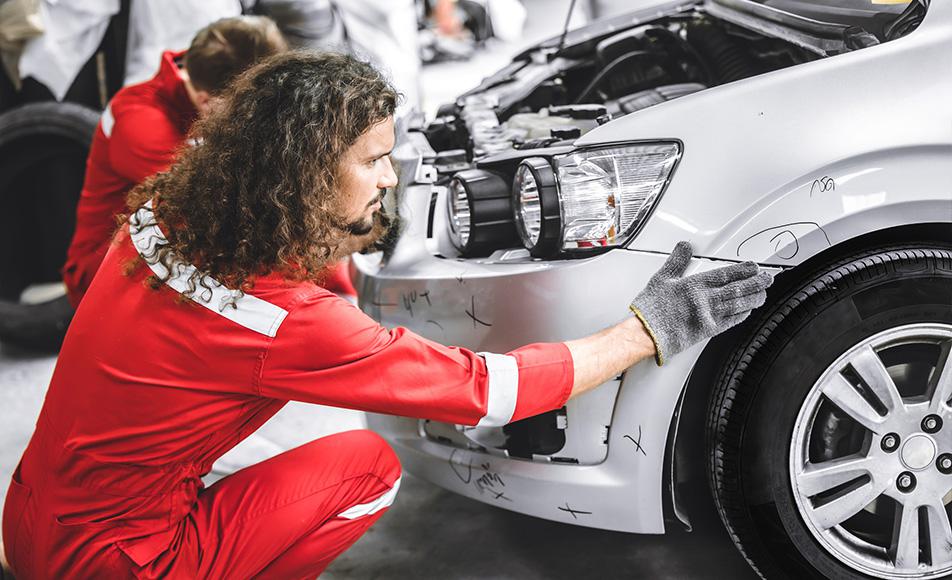 team working service repair fix damaged front bumper